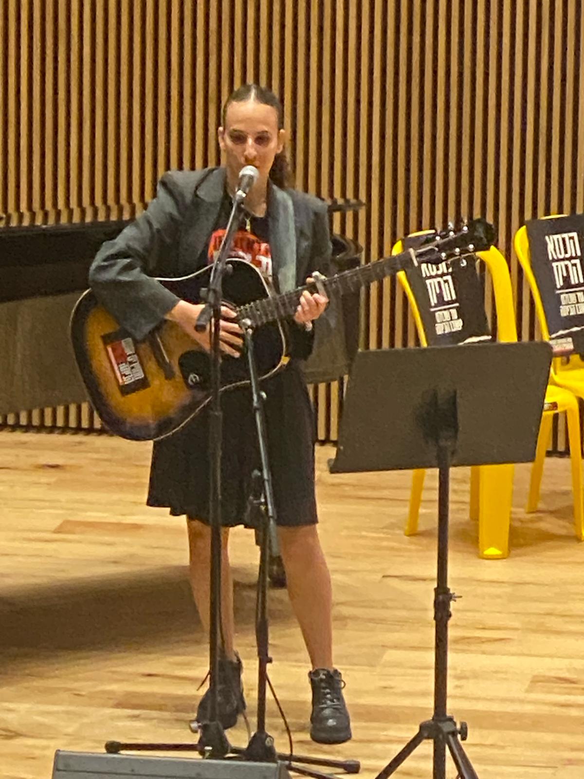 Rotem Sharabi performing memorial song